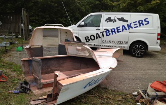 The Issues of Boat Disposal - A Small Fibreglass/Wood Boat being cut up