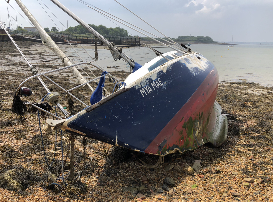 Wrecked FRP Yacht in Portsmouth Harbour