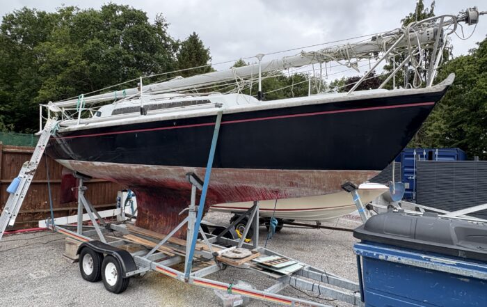 Stripped Achilles 24 in Boatyard