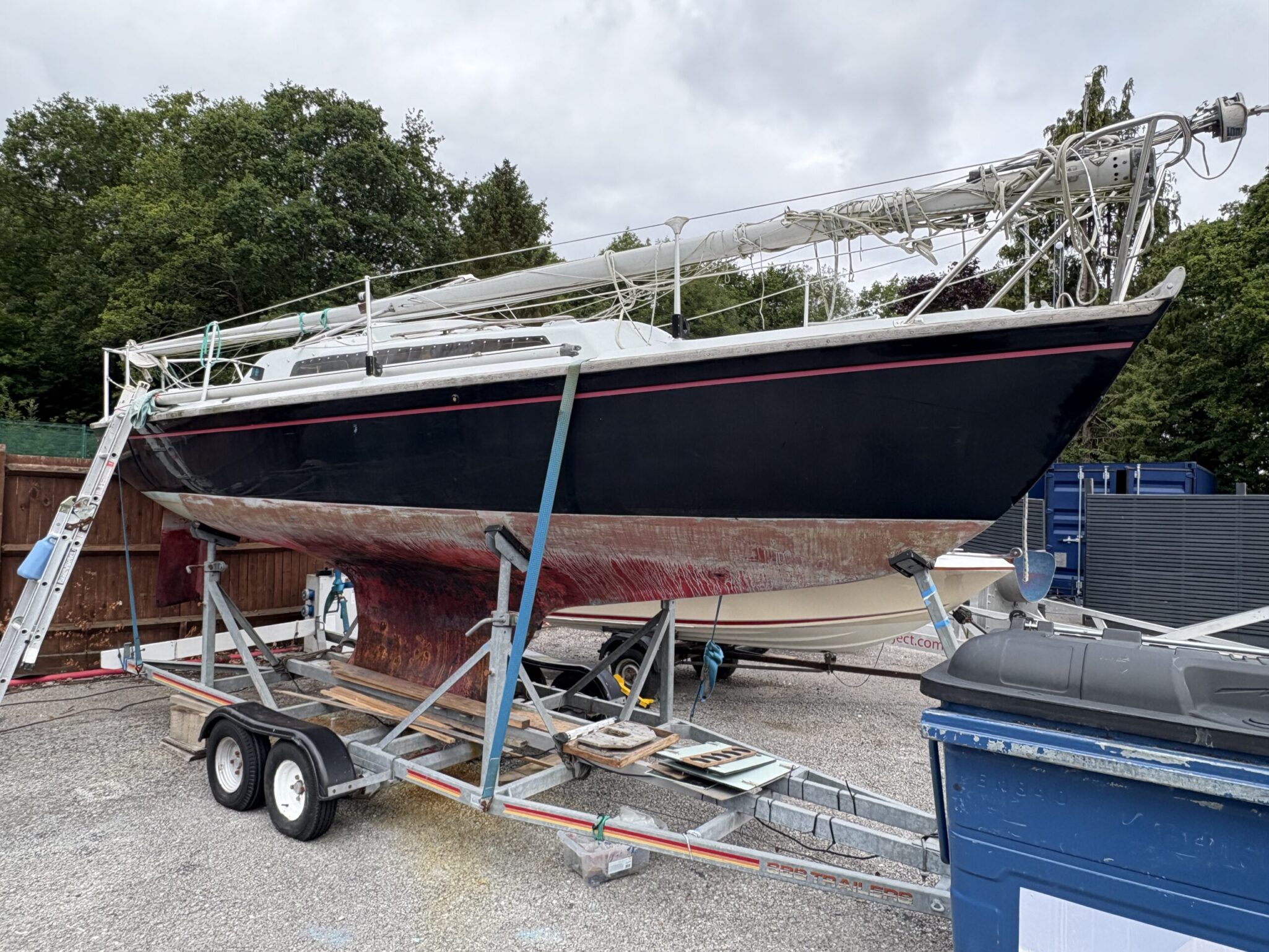 Stripped Achilles 24 in Boatyard